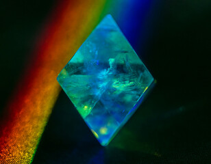 Octahedron crystal with detailed structure in prism light