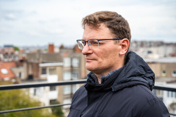 Portrait of a  45 yo business man outdoors looking serious, Brussels, Belgium