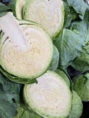 Cut and whole raw organic cabbage background