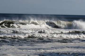 Ocean waves crashing off the beach 