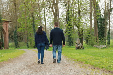 Fototapeta premium Couple of boys walking in an avenue of a castle, Alessandria, Piedmont, Italy