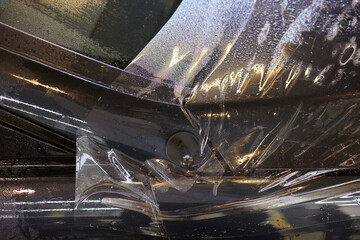 Applying protective film to car hood for added durability