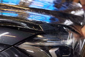 Applying protective film to car hood for added durability