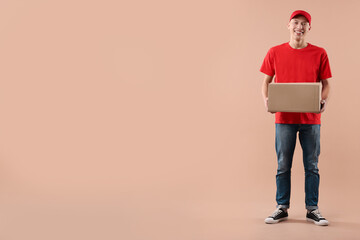 Happy courier with parcel on beige background. Space for text