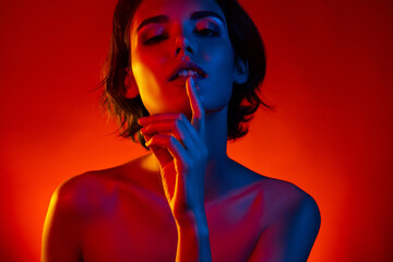 Photo of adorable seductive lady wear nothing finger mouth lips isolated orange filter color...