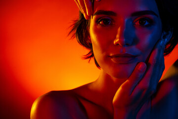 Photo of erotic sweet lady wear nothing arms applying cream empty space isolated orange filter...