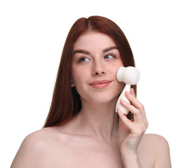 Washing face. Young woman with cleansing brush on white background