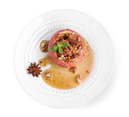 Tasty baked apple with nuts, honey and anise star isolated on white, top view
