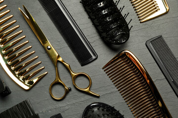 Hairdressing tools on grey textured background, flat lay