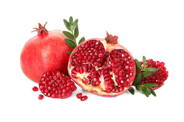 Fresh pomegranates and branches isolated on white