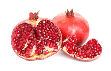 Cut and whole pomegranates isolated on white