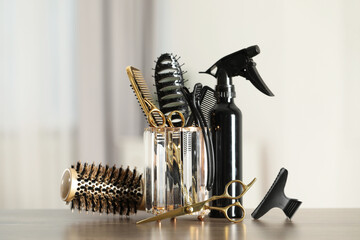 Set of hairdresser tools on table in salon