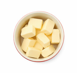 Tasty butter cubes in bowl isolated on white, top view