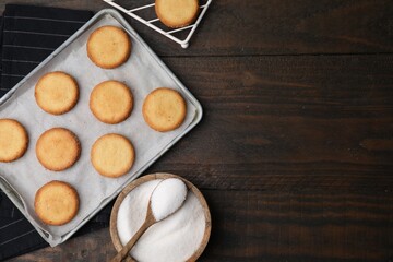 Tasty sweet sugar cookies on wooden table, flat lay. Space for text