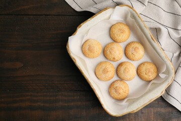 Tasty sweet sugar cookies in baking dish on wooden table, top view. Space for text