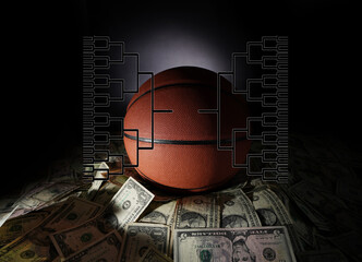 Basketball on a pile of money with a tournament bracket