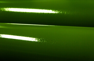 Enigmatic Emerald Elegance: A Close-Up of a Roll of Green Material