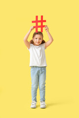 Cute little girl with hashtag on yellow background