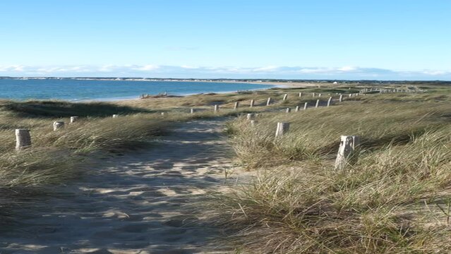 A small sand path along the bay of Pen Bron. La Turballe, France - April 28, 2024.