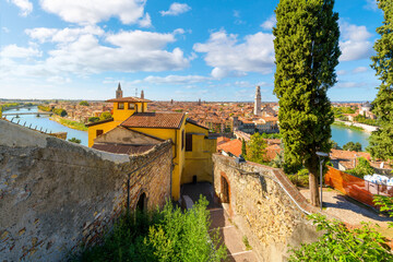 Panoramic view from the Castel San Pietro fortress and ruins of the medieval city of Verona Italy, with the River Adige and Ponte Pietra bridge in view.
