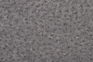 Gray felt tones textile textured material color swatch sample fibers detail background.	