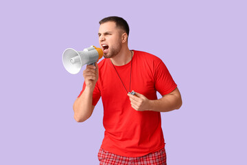 Young lifeguard with whistle shouting into megaphone on lilac background