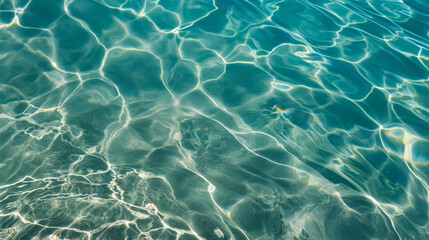 Serene image capturing the captivating play of sunlight on the gentle ripples of clear blue water. Perfect for backgrounds or depicting calm and clarity - obrazy, fototapety, plakaty