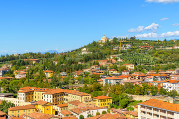 Fototapeta premium The hilltop Santuario della Madonna di Lourdes, or Sanctuary of our Lady of Lourdes Church sits atop Forte San Leonardo hill above the city of Verona, Italy. 