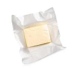 Block of tasty butter in open foil packaging isolated on white, top view