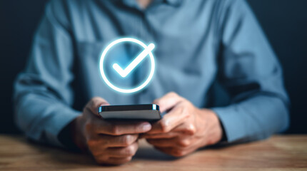 security, server, software, check, information, social, network, employee, communication, checkmark. A man is holding smartphone and check mark is displayed. Concept of accomplishment or satisfaction.