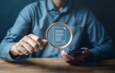 magnifying glass, paper, glasses, agreement, contract, document, paperwork, report, research, magnifying. A man is holding a magnifying glass over a piece of paper. and a man is holding smartphone. - obrazy, fototapety, plakaty