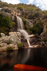 waterfall and stone in the forest in long exposure