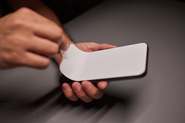A white sticker protecting the smartphone screen