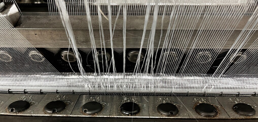 A break in the textile threads during the knitting of the fabric with a textile knitting machine with the necessity of repair