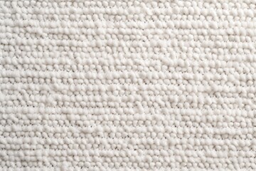 White close-up of monochrome carpet texture background from above. Texture tight weave carpet blank empty pattern with copy space for product 