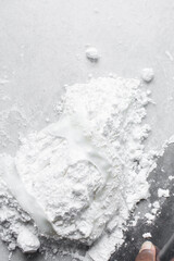 fondant or gumpaste for decorating cake on a white marble countertop, making white fondant on a marble surface