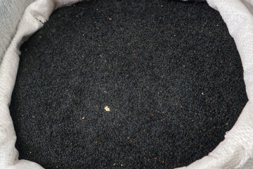 A photo of a bag full with Nigella
 black seeds at Akko market 