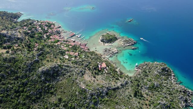 antalya kekova kalekoy castle aerial drone video turquoise blue sea cloudy sky settlement port and peninsula