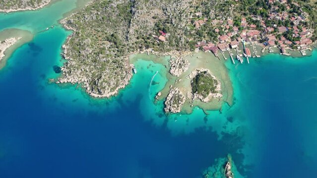antalya kekova kalekoy castle aerial drone video turquoise blue sea cloudy sky settlement port and peninsula