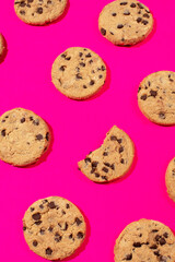 Fresh cookies with chocolate chips on a pink background. Dessert, a pastry shop. Pattern. 