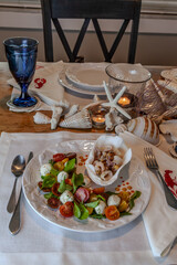Seafood mix and Caprese salad with cherry tomatoes, mozzarella, basil, and arugula