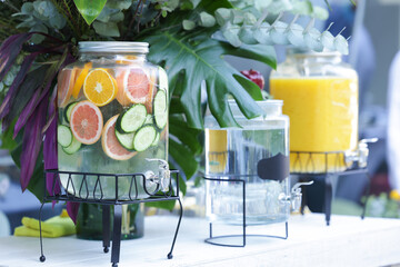 Glass water dispensers with fruit infused water for reception or catered event.