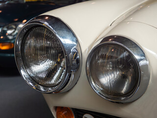 Close-Up of Vintage Car Headlights at Show