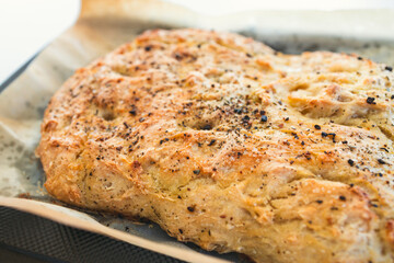 homemade flat bread with herbs and pepper topping