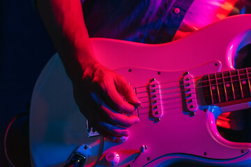 Musician Playing Electric Guitar During Live Concert