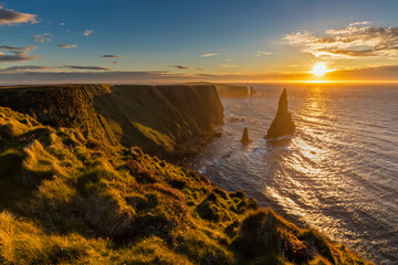 UK, Scotland, Caithness, Coast of Duncansby Head, Duncansby Stacks at sunrise