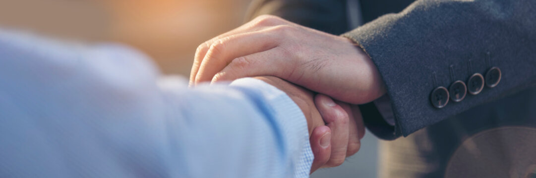 Banner Lawyer teamwork partnership Businessman handshake together. Panorama Two Men Trust honesty lawfirm business handshake promise respect partner. Diversity solidarity team Partner hands together
