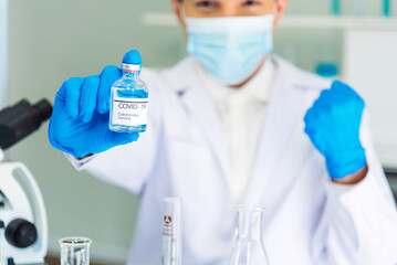 Fototapeta premium Scientist man holding chemical test glass tube testing science laboratory. Doctor clinic healthcare lab technician diagnosis sample. Asian man scientist working vaccine test medical biochemistry lab