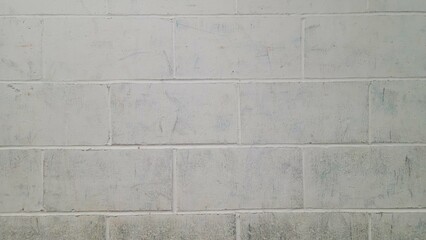 Worn white brick background. Smudged brick backdrop.