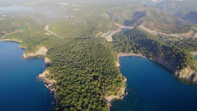 Antalya Kemer Phaselis cape bays blue sea and land forest area foggy blue sky